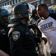 A man talks to police April 28, 2015, near the CVS pharmacy that was set on fire in Baltimore the day during violent unrest following the funeral of Freddie Gray.
Andrew Burton/Getty Images